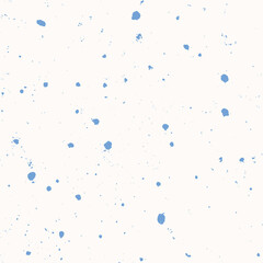 Chaotic uneven sprayed spots or dots seamless vector pattern. Hand drawn splash texture. Shades of blue spray on cream background. Tiny specks or blobs of various size abstract ornament for fabric