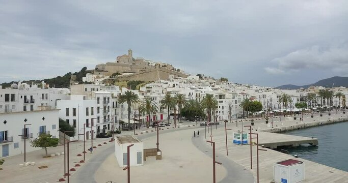 Aerial footage of promenade and old town with castle, Ibiza, Spain