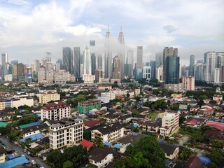 Fototapeta na wymiar Kuala Lumpur, Malaysia - July 16, 2020: View of Kuala Lumpur skyline during after rain. 