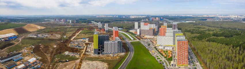 New residential areas and new buildings in Moscow. Aerial view of the area near the Salaryevo landfill and a new metro line.