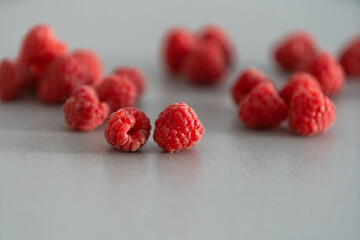 red Raspberry fruit on gray background