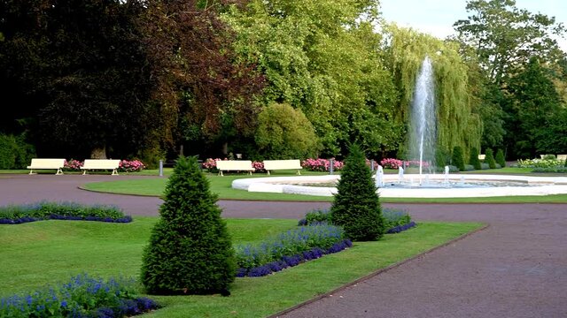 Bushes, plants, and fountain in park Stadsparken in Lund, Sweden