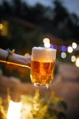 Beer foam outside with blurry lights background