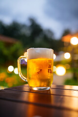 Beer foam outside with blurry lights background