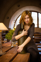 Young girl in the old-fashioned cosy place