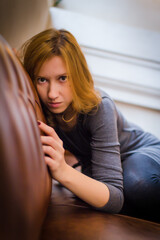 Young girl in the old-fashioned cosy place