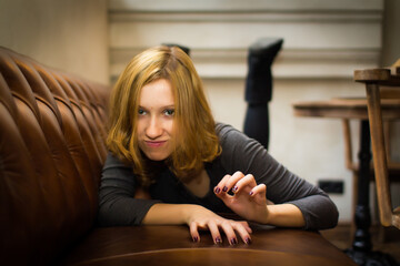 Fototapeta premium Young girl in the old-fashioned cosy place