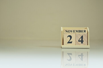 November 24, Number cube with the reflection on the ground.