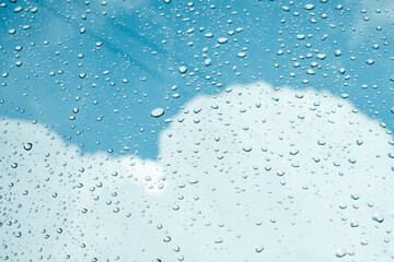 Rain drops on window pane glass surface