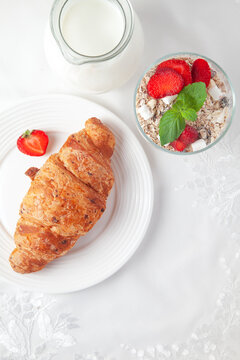 Croissant With Strawberries, Oatmeals Flakes, Marsh Mallows, Milk And Fresh Mint