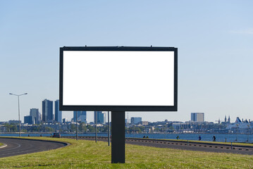 White Mockup billboard on a background of cityscape and sea. suitable for advertising. Blank billboard and outdoor advertising. White Mockup poster outside. Tallinn, Estonia.