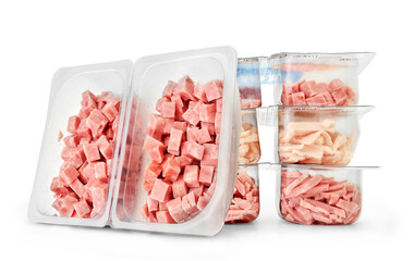 Packaged piaces of ham in a studio setting, isolated on white