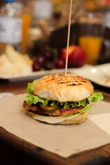 Burgers with lettuce, cutlet and tomatoes. Burgers in the restaurant. Burgers close up. Fast food, wrong food. Fat. Obesity