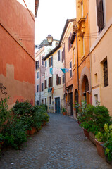 Fototapeta na wymiar Street with hanging laundry in Rome, Italy