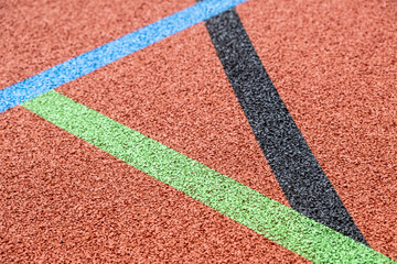 modern artificial surface of a polytan sports field with colored lines