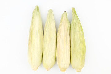 Raw corn on a white background