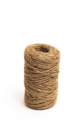A skein of brown twine on a white background. Isolate.