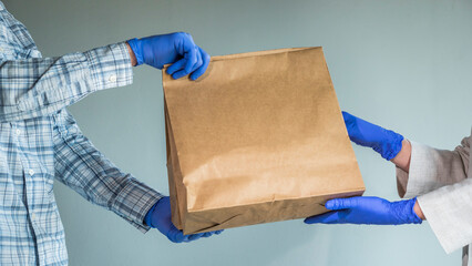 Transfer the bag of food in protective gloves. Food delivery