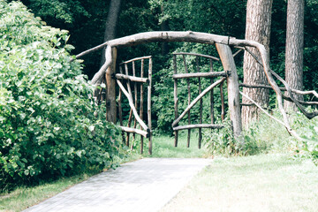 Wooden fairy gate in the forest. Opening secret wooden door