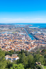 Sète in France, aerial panorama, the harbor and the city with typical tiles roofs
