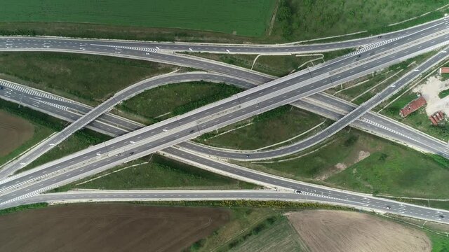 Aerial view of highway and overpass. Road junction, highway intersection top view. Top down view of road traffic