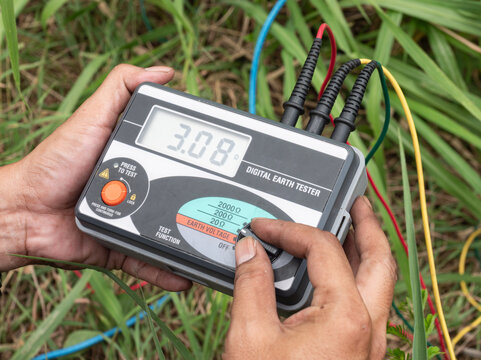 The engineer is using digital earth tester for measure insulation resistance between the electrical part with grounding or earth to protect short circuits..