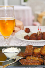 Garlic and black bread snacks with sour cream and greens sauce. perfect snacks with beer.