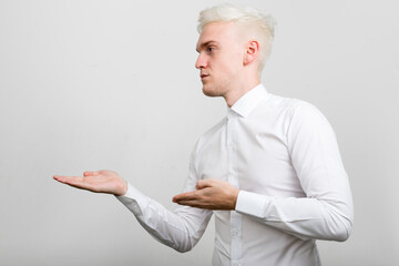 Portrait of young businessman with blond hair