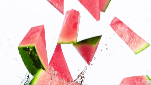 Fresh Water Melon Slices Falling into Water in Super Slow Motion. Shot at 1000 fps