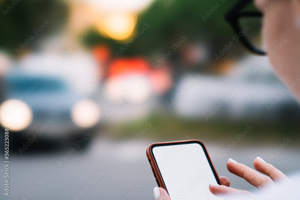 Poster cropped view of female hands holding smartphone with copy space area for your internet content.woman