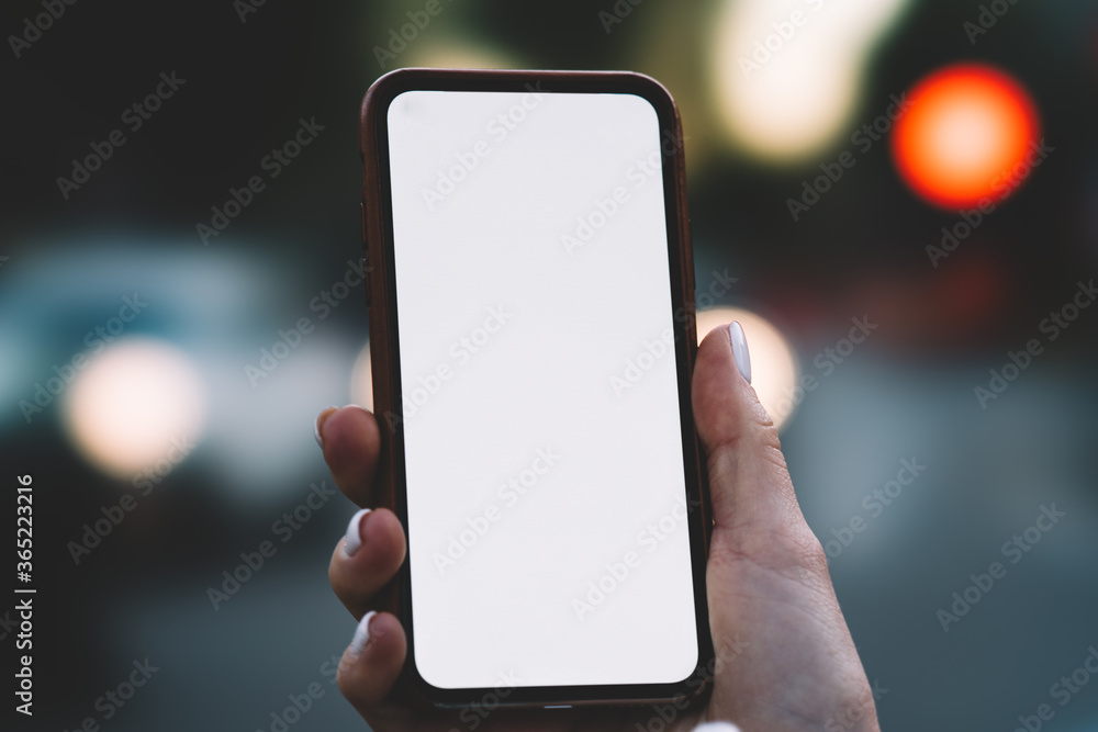 Poster cropped view of woman's hands holding modern smartphone with blank screen area for your internet web
