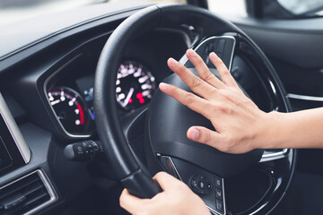 man pushing horn while driving sitting of a steering wheel press car, honking sound to warn other...