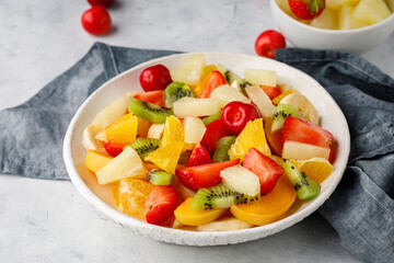 Fresh chopped fruit salad in a bowl.