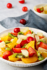 Fototapeta na wymiar Fresh chopped fruit salad in a bowl.