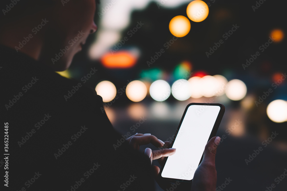 Aufkleber cropped view of hipster female blogger holding modern mobile phone in hands and updating app on devi
