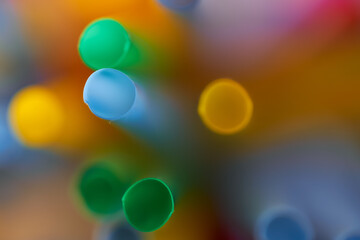 Blurred Background Multicolored Plastic Drinks Tubes. Close-up.
