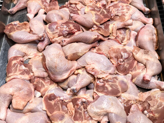 Fresh butcher chicken hips sold at the market.