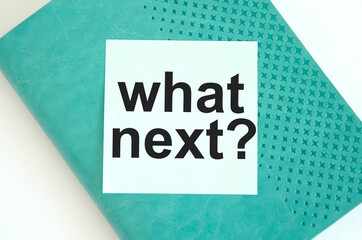  text it what next with you available written on a blue background and notepad