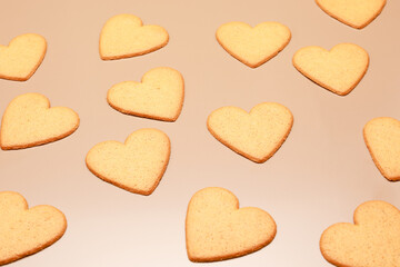 View from the top at brown ginger cookie in form like heart isolated on color background 