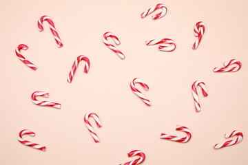 View from the top at white and red striped candy lollipop isolated on color background