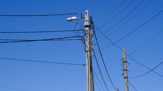 
Electric pole with wires in the countryside
