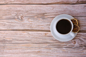 Top view coffee cup and coffee beans on wood table, space for text