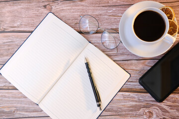 Top view coffee cup and coffee beans on wood table, space for text