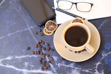 Top view coffee cup and coffee beans on wood table, space for text