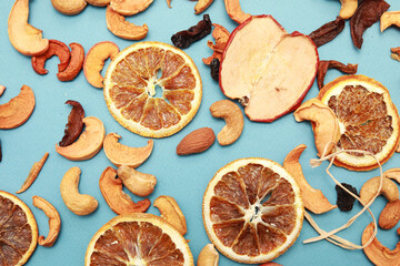 Close up top view of isolated hazelnut pattern backdrop.Cashew, almond nuts and dry fruits on a blue background. 
