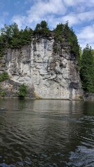 Fototapeta na wymiar Kayaking on a river near rock