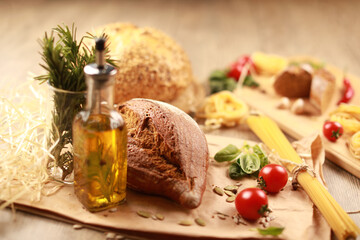 close up view on bread with tomato and rosemary, garlic,basil,spaghetti,sunflower oil and rosemary...