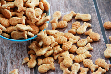dry salted fish cookies on a wooden background 