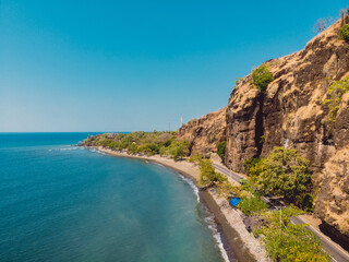 Fototapeta na wymiar Aerial view of sea with rocks and road in Northern Bali