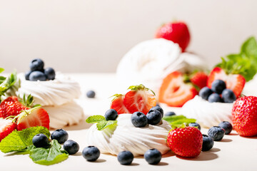 Dessert pavlov with strawberries and blueberries
